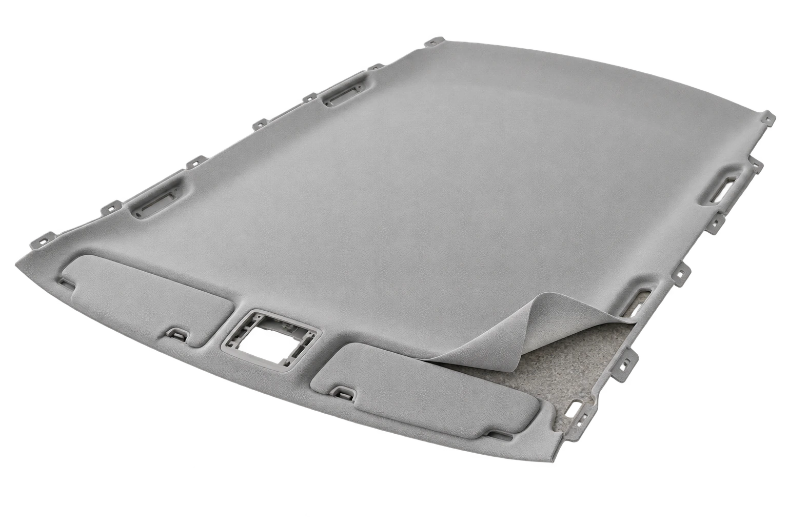 Three-dimensional automotive headliner with grey textile partly lifted to expose its shaped carrier and adhesive interface
