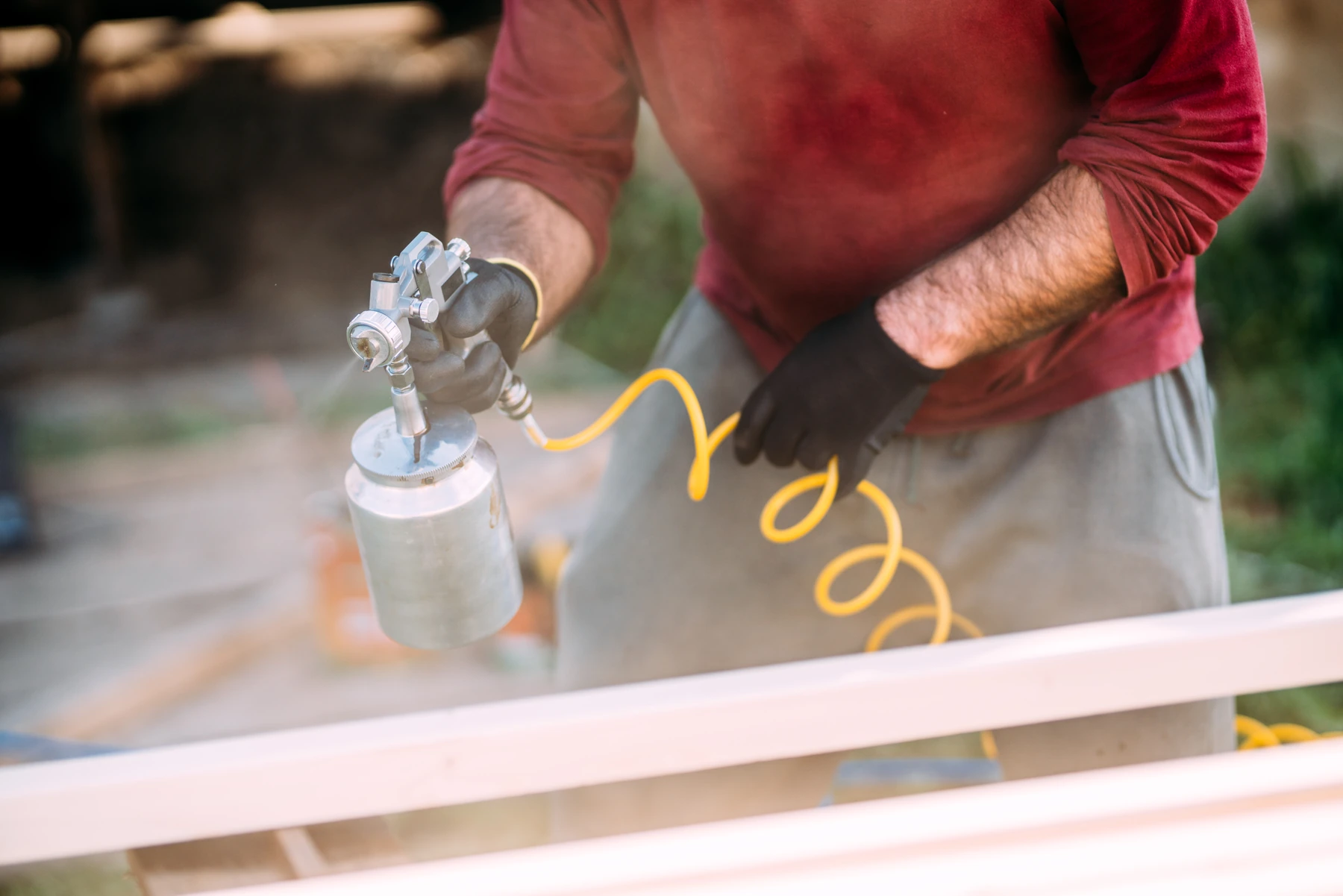 Spray application to a shaped furniture component