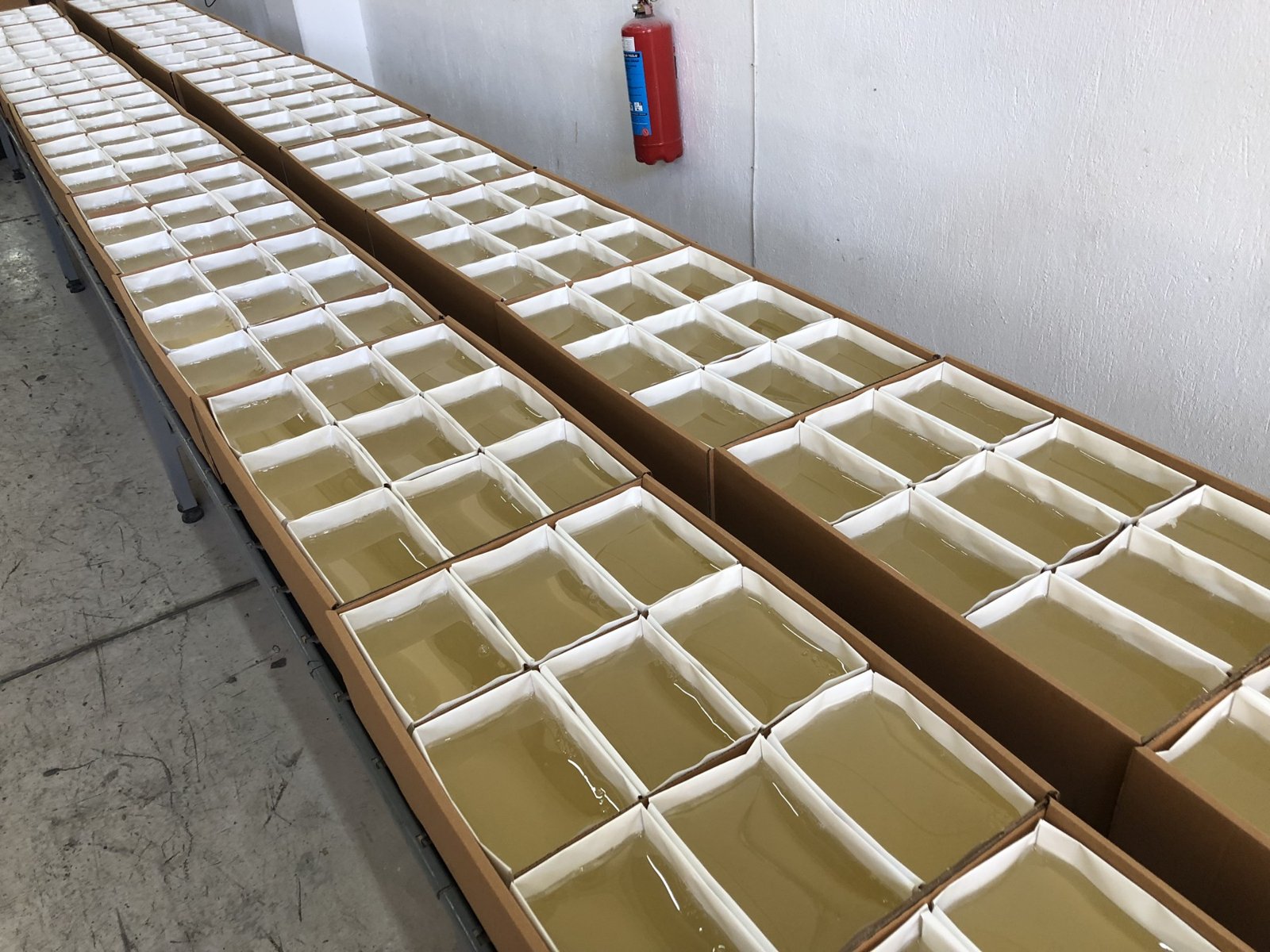 Hotmelt blocks in open cartons at OYTI
